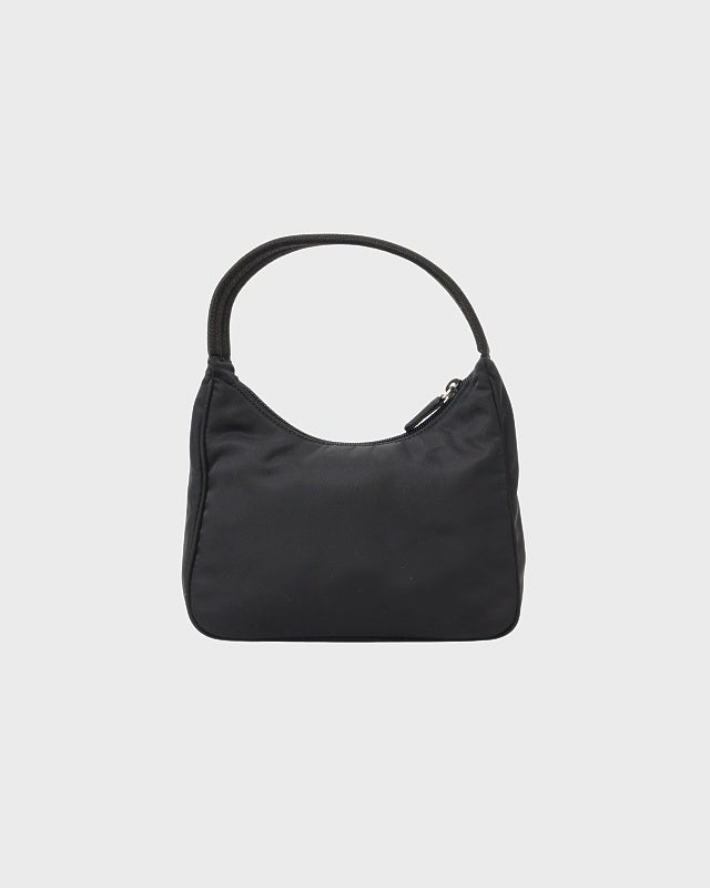 PRADA ナイロン ハンドバッグ メタルハンドル 三角ロゴ ブラック PRADA 三角ロゴ金具ナイロンハンドバッグ | Hedy